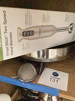 Cuisinart hand blender box, partial view of electric skillet and mesh strainer