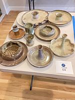 Top view of all twelve ceramic pieces on table