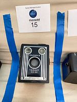 Front view of Kodak Brownie Target Six-20 box camera showing lens, twin viewfinders and branding