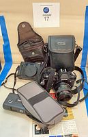 Group shot of all cameras, cases and manual