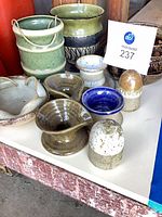 overview of assorted pottery on table