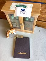 Cabinet with essential oils, notebook, plush bear