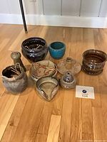 Group shot of all nine ceramic pieces on floor