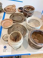 Overview of multiple Robert M Shapiro pottery pieces on table