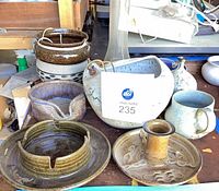 Group view of seven Robert M Shapiro stoneware pieces