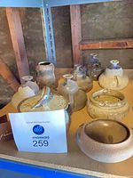 Shelf view showing entire assortment of Shapiro pottery pieces