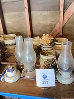 overview of pottery pieces on shelf
