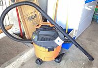 Full view of Ridgid wet/dry shop vacuum with hose and wand attached