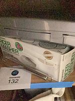 Boxed Progressive ricer & masher with whisk alongside