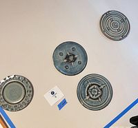 all four ceramic plaques hanging on wall