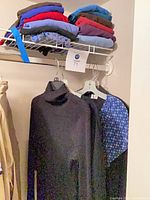 Shelf with folded tops, hangers below