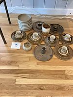 Full lot overview on floor showing all ceramic pieces