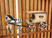 left side view of horse and bread van toy