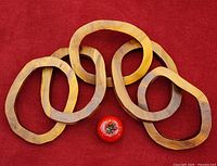 Chain laid flat showing five links with scale reference