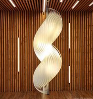 Full frontal view of spiral pendant lamp illuminated