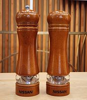 Front view of both teak Nissan spice mills