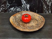 Top view of carved wooden bowl showing interior wear and patina