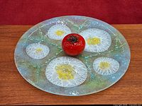 Platter top view showing fried egg design and coloration