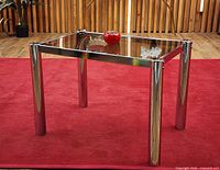 Full view of side table on red carpet