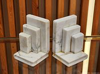 Front view of both white marble book-shaped bookends