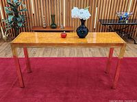 Front view of entire console table on red rug
