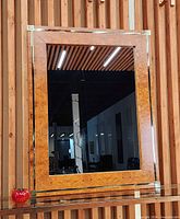 Front view of Zevi burl wood and brass inlay mirror