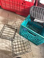 Overall lot with milk crate, resin basket, metal baskets and wire shelves visible