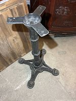 Full view of cast iron pedestal showing column and mounting plate