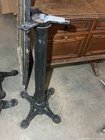 Full view of cast iron pedestal showing mounting plate and column