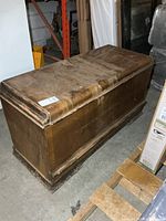 Full view of cedar chest on floor