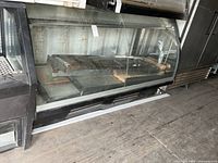 Full view of curved glass refrigerated display counter