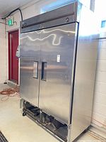 Full view of the True T-49 two-door refrigerator showing overall condition and size