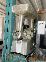 Front view showing grinder body, head and feed tray with model tag