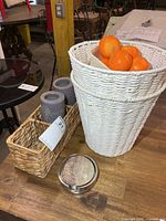 Pair of white rope baskets, seagrass tray with candles, coaster holder