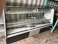 Front view of glass refrigerated display case showing overall size and exterior condition