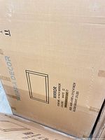 Sealed box showing Terra Decor branding and line drawing of mirror