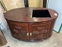 Full view of oval dry sink cabinet top and body