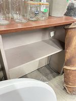 Shelving unit overall view showing top, interior shelf, open bottom