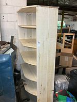 Tall solid wood display shelf showing five shelves and unfinished wood