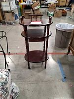 Full view of three-tier wooden phone table