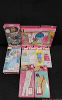 All boxed and carded Barbie items displayed together