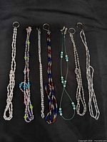 All six eyeglass chains laid out side by side
