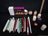 Overview of entire candle bundle including tapers, boxed set, holders and pillars