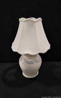 Full view of ceramic lamp with shade