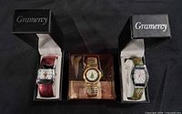 Group shot of all three Christmas watches in boxes