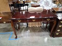 Front view of entire console table showing drawers and legs