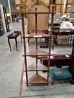 Full front view of five-tier corner shelf