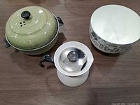 Three main pieces: green covered pot, white carafe, mushroom bowl