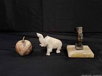 Group view of the three decorative figurines