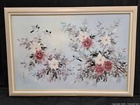Full view of framed floral and bird painting